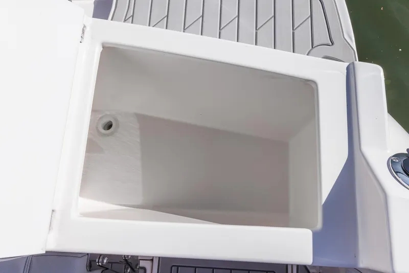 Slide: The Image of Open storage compartment on 2025 Solara S-250 Coupe boat deck. - 9