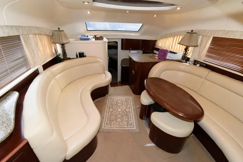 Slide: The Image of Luxurious interior of 2006 Sea Ray 40 Motor Yacht with elegant seating and dining area. - 11