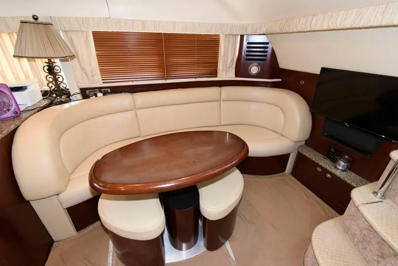 Slide: The Image of Luxurious interior of 2006 Sea Ray 40 Motor Yacht with plush seating and elegant table. - 12