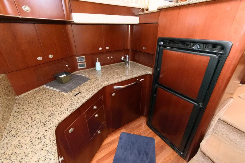Slide: The Image of Luxurious kitchen area in 2006 Sea Ray 40 Motor Yacht with granite countertops. - 15