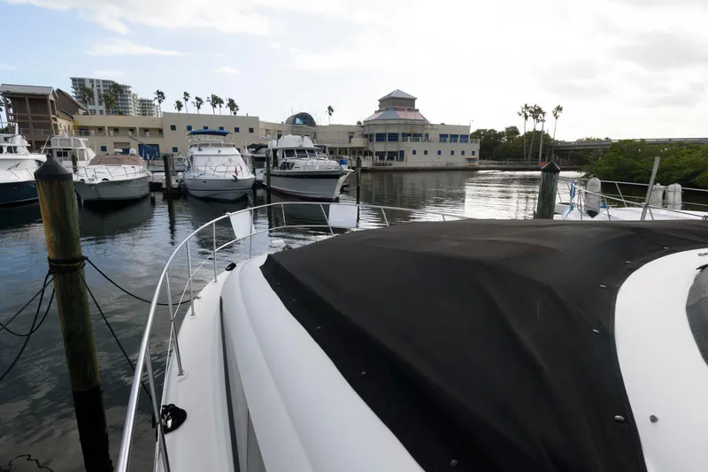 Slide: The Image of 2006 Sea Ray 40 Motor Yacht docked in a marina with other boats. - 2