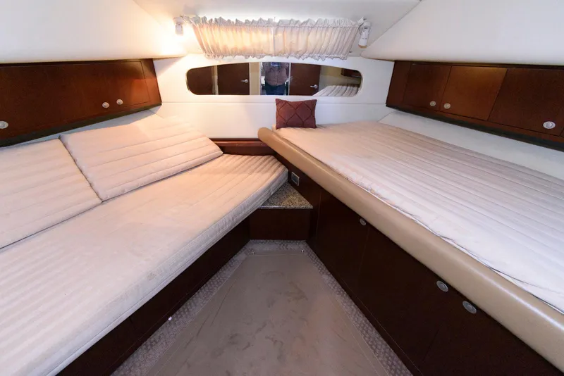 Slide: The Image of Interior cabin of 2006 Sea Ray 40 Motor Yacht with twin beds and wood cabinetry. - 21