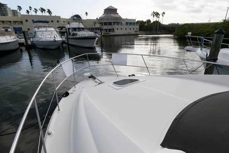 Slide: The Image of 2006 Sea Ray 40 Motor Yacht docked at marina, calm waters, overcast sky. - 3