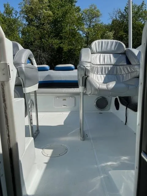 Slide: The Image of 2006 Baja 35 Outlaw boat interior with white seating and open deck. - 13