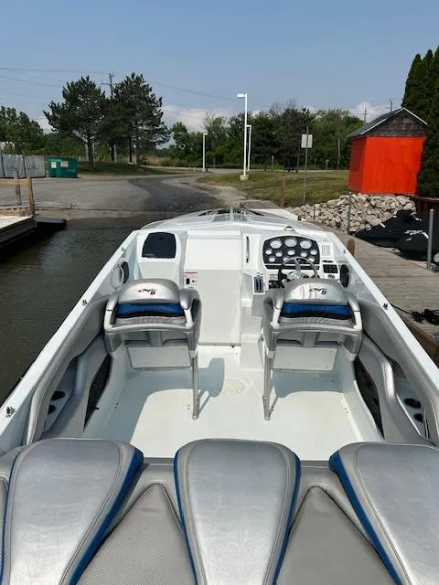 Slide: The Image of 2006 Baja 35 Outlaw boat interior with dual seats and control panel. - 17