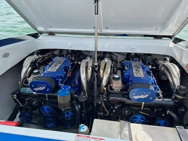 Slide: The Image of Twin engines in a 2006 Baja 35 Outlaw boat, open engine compartment view. - 23