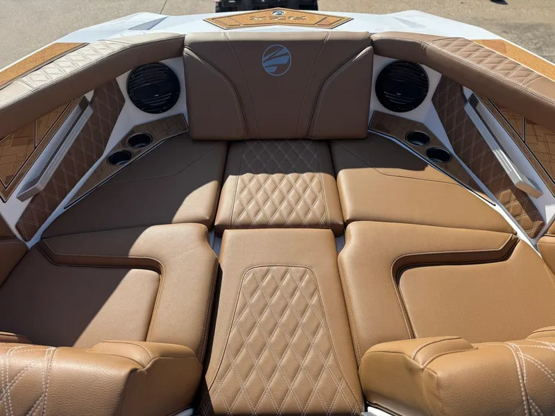 Slide: The Image of Luxurious interior of 2025 Tigé 22RZX boat with tan leather seating and speakers. - 14