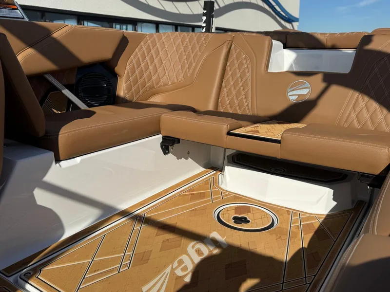 Slide: The Image of 2025 Tigé 22RZX boat interior with tan leather seats and custom flooring. - 8