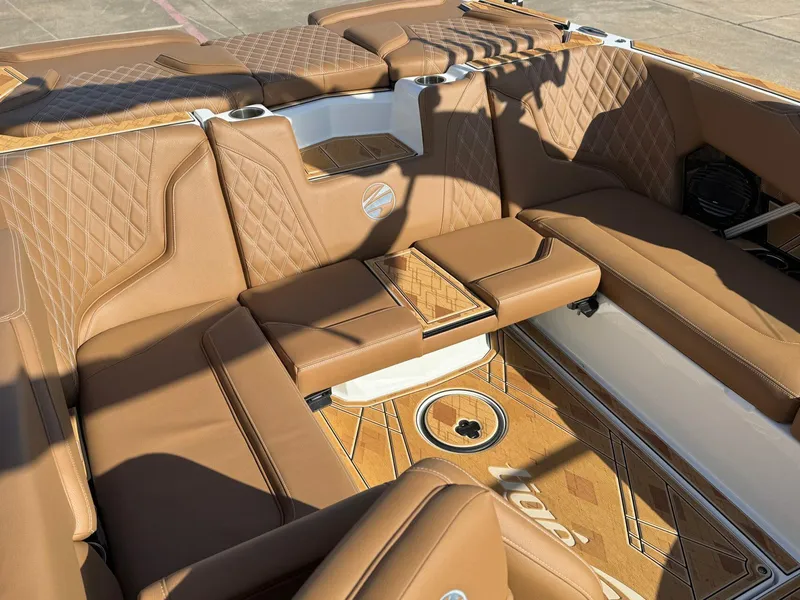 Slide: The Image of Luxurious interior of 2025 Tigé 22RZX boat with tan leather seating and elegant design. - 9