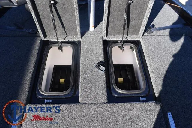 Slide: The Image of 2025 Bass Cat Puma STS boat storage compartments, Thayer's Marine logo visible. - 16