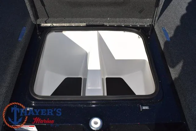 Slide: The Image of 2025 Bass Cat Puma STS storage compartment, open lid, spacious interior, Thayer's Marine logo. - 17