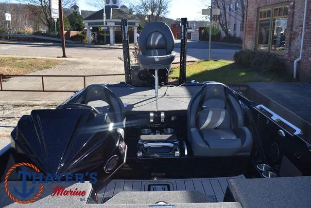 Slide: The Image of 2025 Bass Cat Puma STS boat interior with seating and controls, displayed at Thayer's Marine. - 20