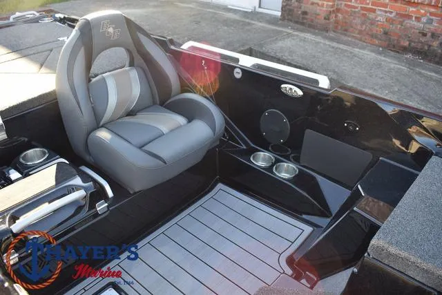 Slide: The Image of 2025 Bass Cat Puma STS interior with gray seating and cup holders. - 21