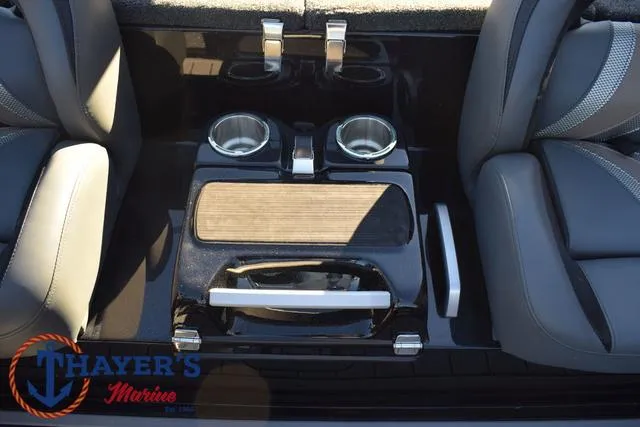 Slide: The Image of 2025 Bass Cat Puma STS interior with cup holders and storage compartment. - 22