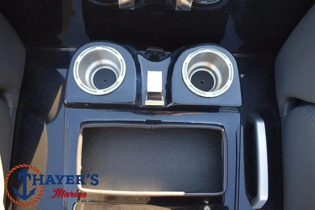 Slide: The Image of 2025 Bass Cat Puma STS console with dual cup holders and storage compartment. - 23
