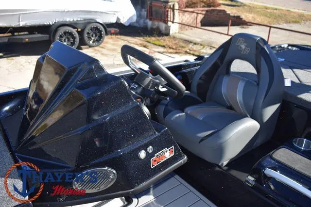 Slide: The Image of 2025 Bass Cat Puma STS boat interior with steering wheel and seat. - 24