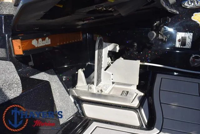 Slide: The Image of 2025 Bass Cat Puma STS boat interior with storage compartment and branding. - 28