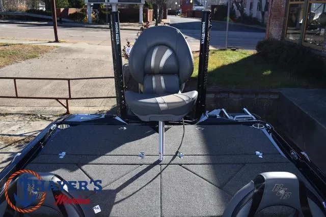 Slide: The Image of 2025 Bass Cat Puma STS boat interior with fishing seat and carpeted deck. - 30