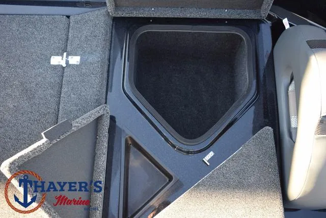 Slide: The Image of 2025 Bass Cat Puma STS storage compartments with Thayer's Marine logo. - 32