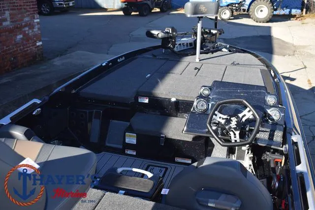 Slide: The Image of 2025 Bass Cat Puma STS boat interior with steering wheel and control panel. - 37