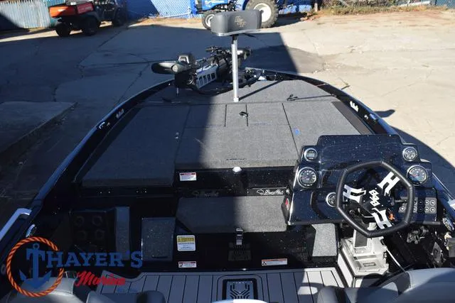 Slide: The Image of 2025 Bass Cat Puma STS boat interior with steering console and seating. - 38