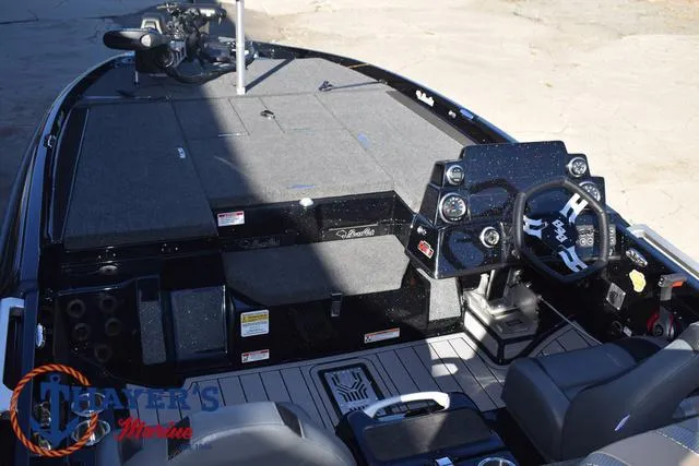 Slide: The Image of 2025 Bass Cat Puma STS boat interior with modern dashboard and seating. - 39