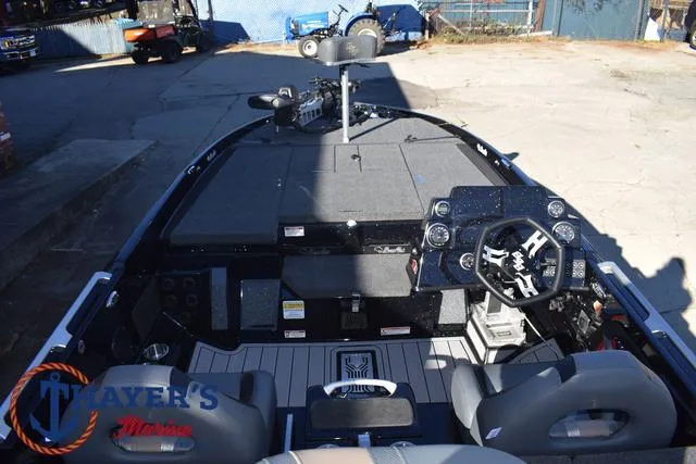 Slide: The Image of 2025 Bass Cat Puma STS boat interior with steering wheel and dashboard controls. - 40