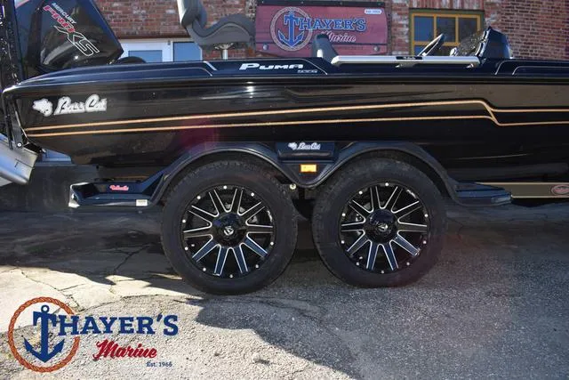 Slide: The Image of 2025 Bass Cat Puma STS boat with custom wheels at Thayer's Marine. - 6