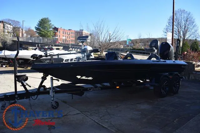 Slide: The Image of 2025 Bass Cat Puma STS boat on trailer in outdoor setting. - 8