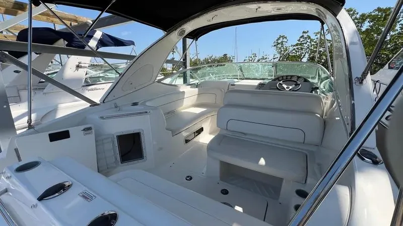 Slide: The Image of 2011 Bayliner 285 Cruiser interior with white seating and steering wheel. - 12