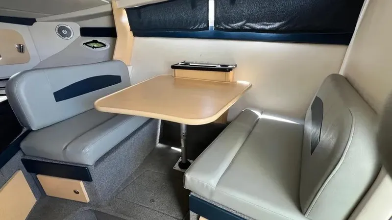 Slide: The Image of Interior of 2011 Bayliner 285 Cruiser with dining area and seating. - 19