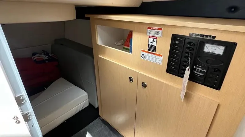 Slide: The Image of Interior of 2011 Bayliner 285 Cruiser with seating and control panel. - 20