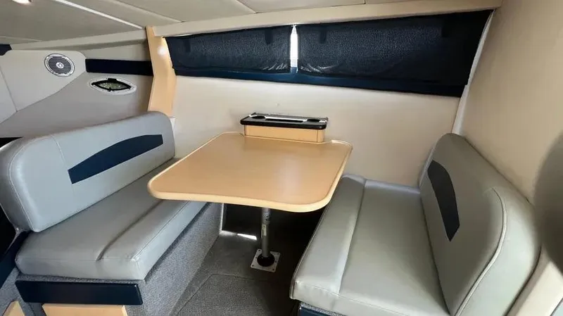 Slide: The Image of 2011 Bayliner 285 Cruiser interior with dining area and seating. - 29