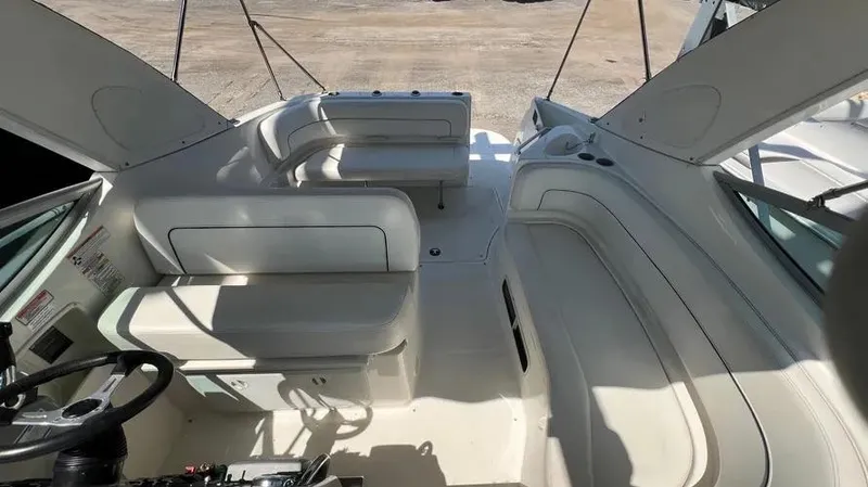 Slide: The Image of 2011 Bayliner 285 Cruiser interior with white seating and steering wheel. - 32