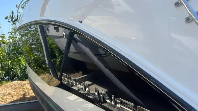 Slide: The Image of 2011 Bayliner 285 Cruiser boat with sleek black and white exterior design. - 34