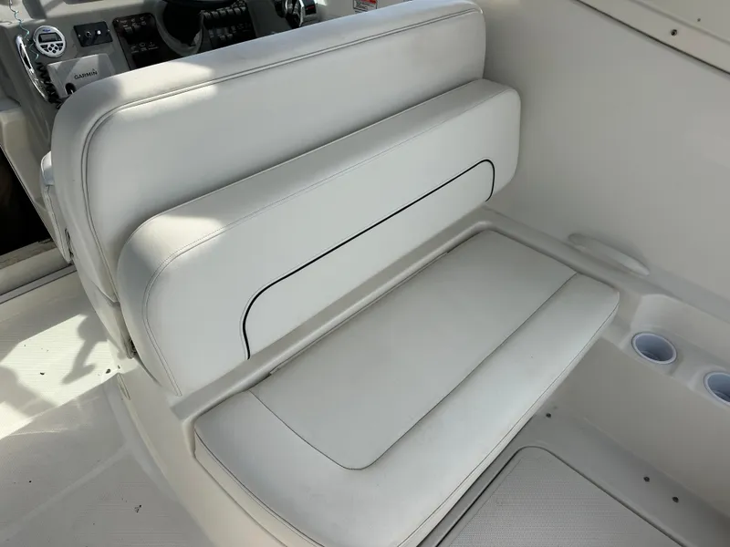 Slide: The Image of White seating area on a 2011 Bayliner 285 Cruiser boat. - 8