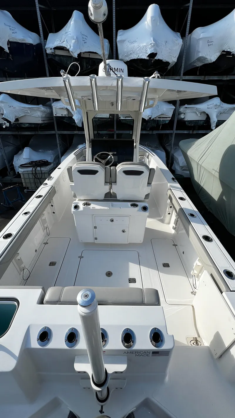 Slide: The Image of 2022 Pursuit S 268 Sport boat interior with seating and storage compartments. - 10
