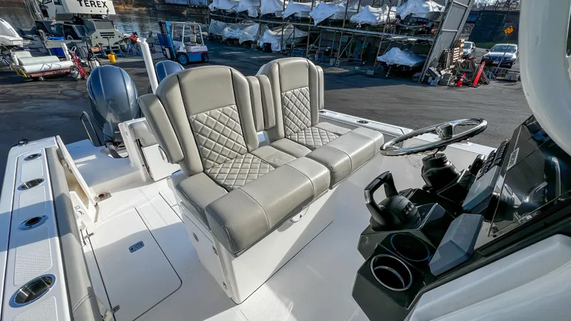 Slide: The Image of 2022 Pursuit S 268 Sport boat interior with dual seats and steering console. - 13