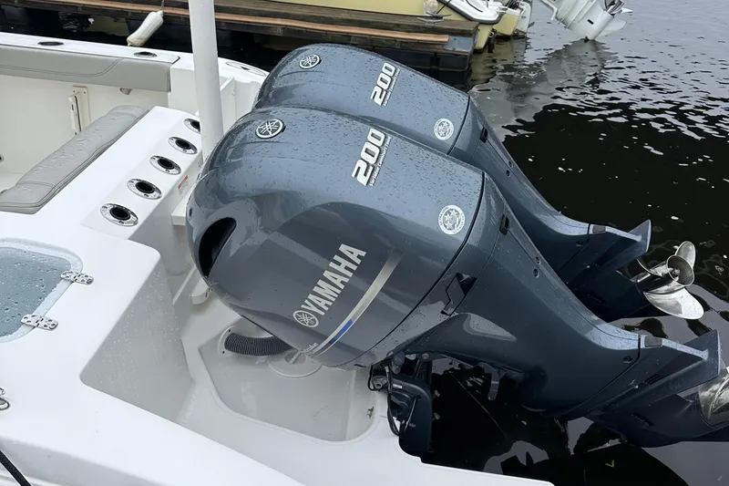 Slide: The Image of Twin Yamaha 200 engines on a 2022 Pursuit S 268 Sport boat. - 2