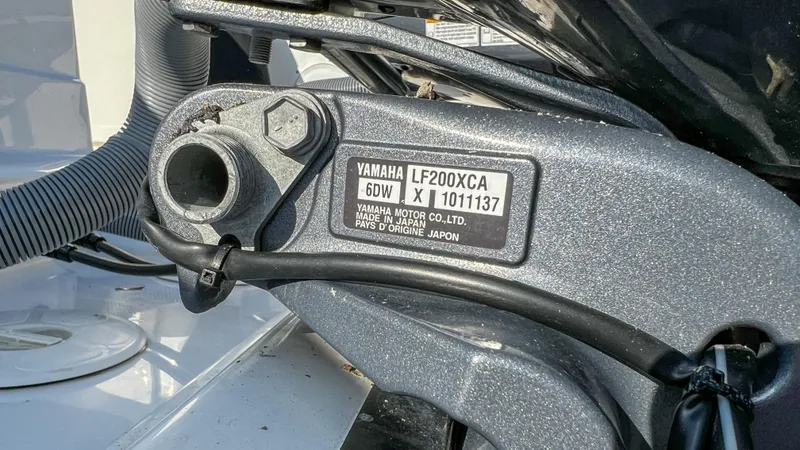 Slide: The Image of Close-up of Yamaha LF200XCA engine part on 2022 Pursuit S 268 Sport boat. - 20