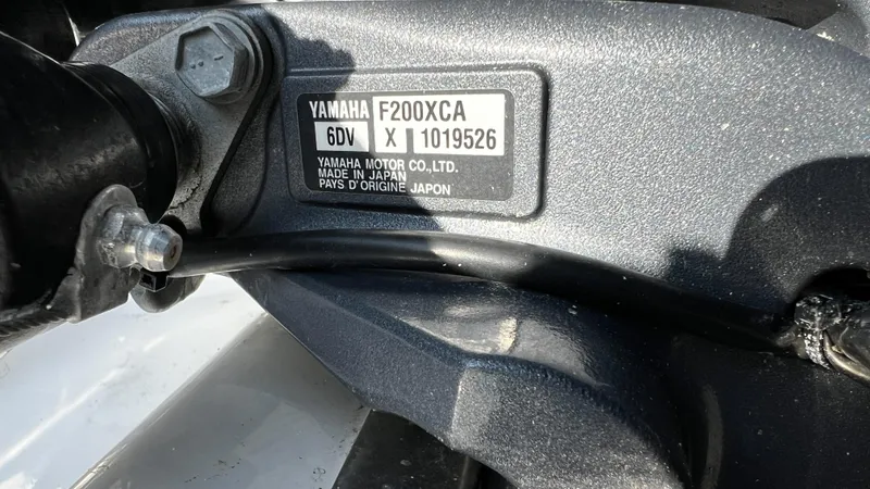 Slide: The Image of Yamaha F200XCA engine label on 2022 Pursuit S 268 Sport boat. - 21