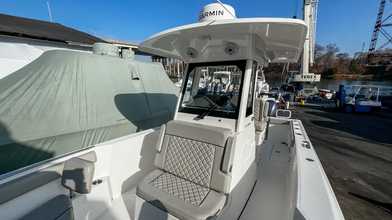Slide: The Image of 2022 Pursuit S 268 Sport boat with Garmin equipment, docked outdoors. - 8