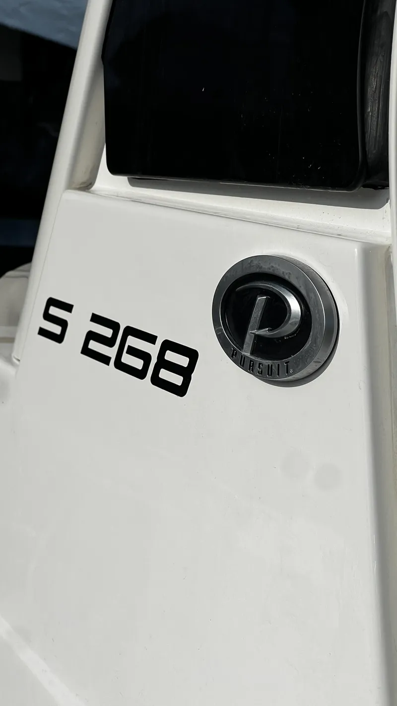 Slide: The Image of 2022 Pursuit S 268 Sport boat logo and model detail. - 9