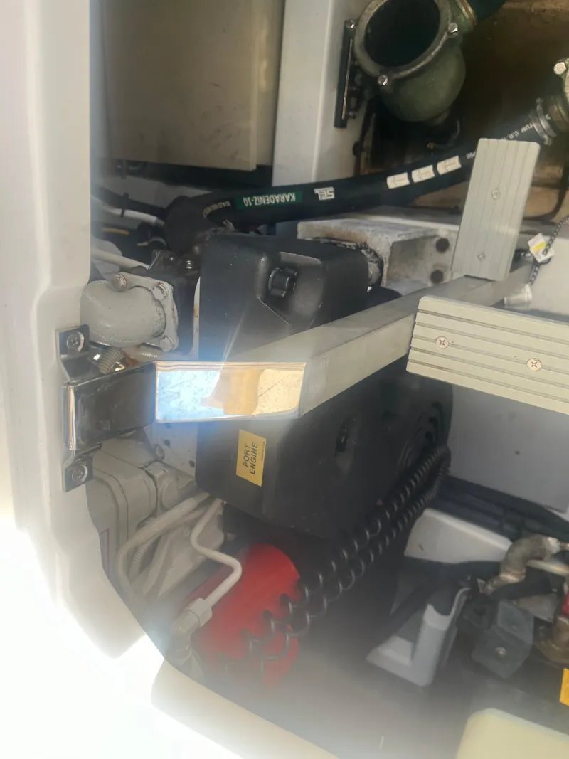 Slide: The Image of Engine compartment of 2013 Azimut 40 Flybridge yacht, showcasing mechanical components. - 11