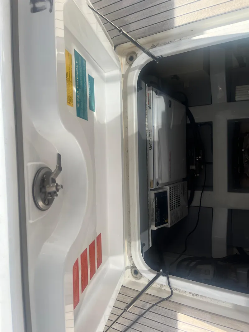 Slide: The Image of Azimut 40 Flybridge 2013 engine compartment with visible control panel and wiring. - 14