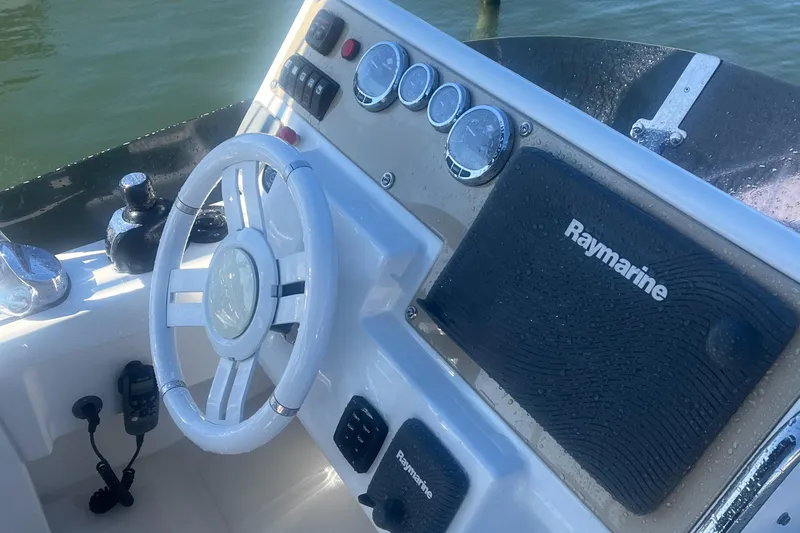 Slide: The Image of Steering console of 2013 Azimut 40 Flybridge with Raymarine navigation system. - 16