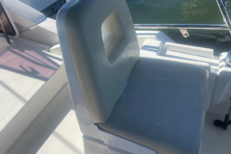 Slide: The Image of Azimut 40 Flybridge 2013 boat seat, white leather, near water. - 17