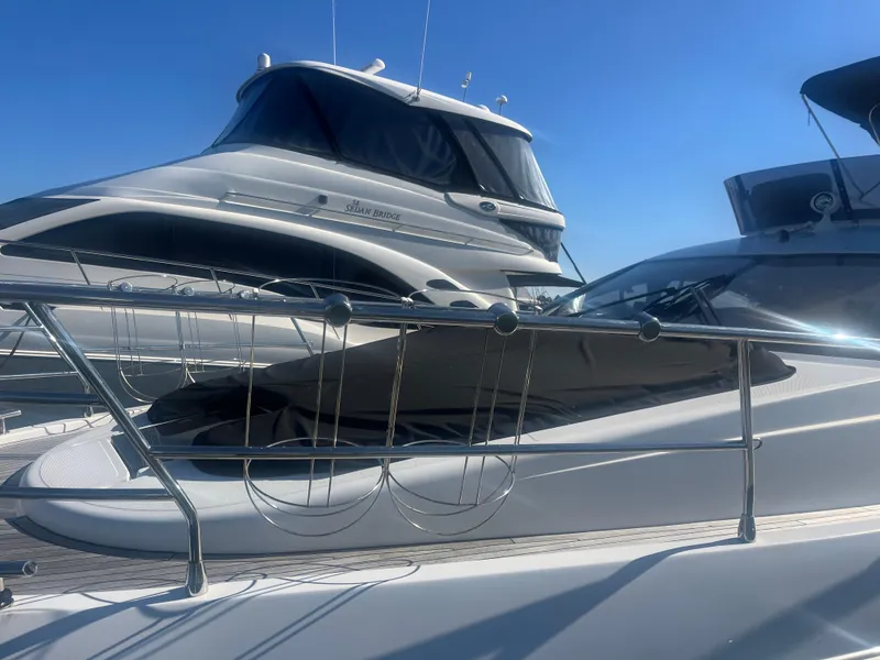 Slide: The Image of 2013 Azimut 40 Flybridge yacht docked under clear blue sky. - 2