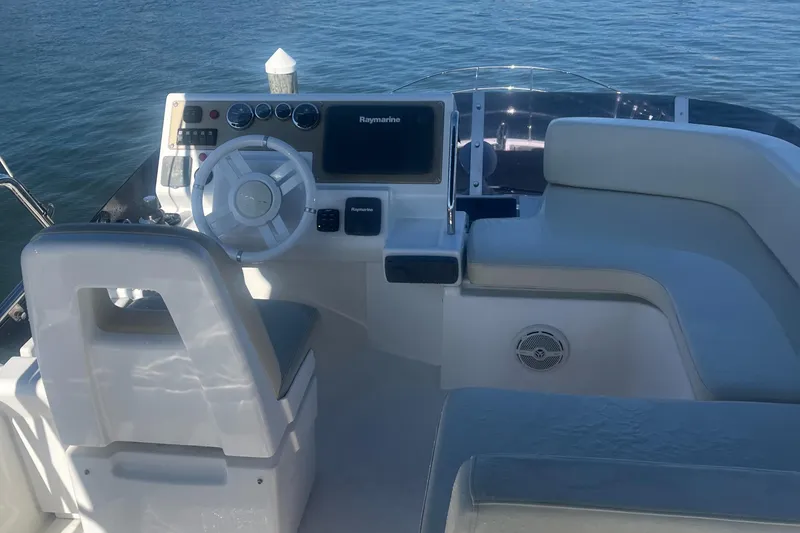 Slide: The Image of Azimut 40 Flybridge 2013 yacht helm with steering wheel and navigation system. - 20