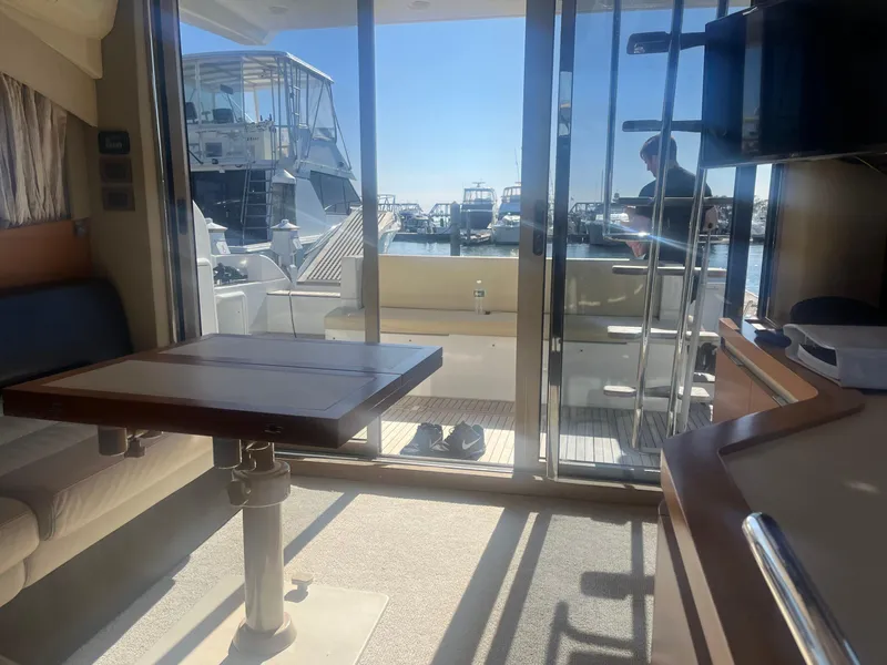 Slide: The Image of Interior view of 2013 Azimut 40 Flybridge yacht with marina in background. - 36